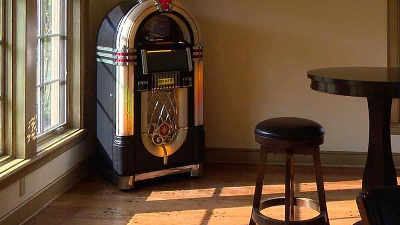A jukebox and bar seating in a finished game room